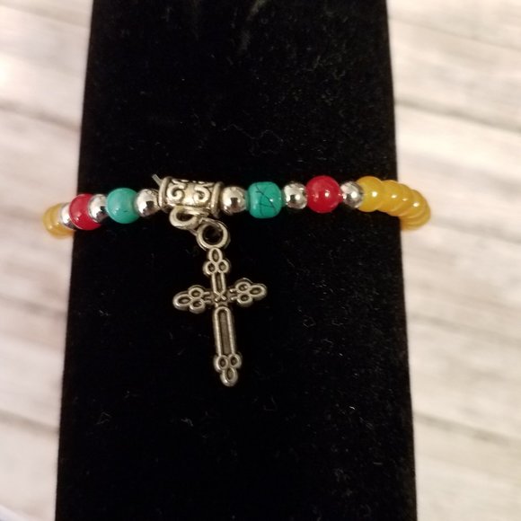 Yellow stretchy bracelet with cross charm - Picture 5 of 5